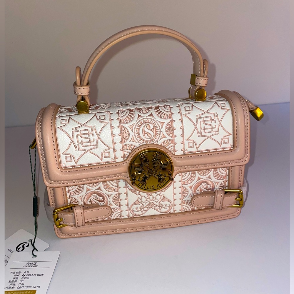 Pink and white accordion purse